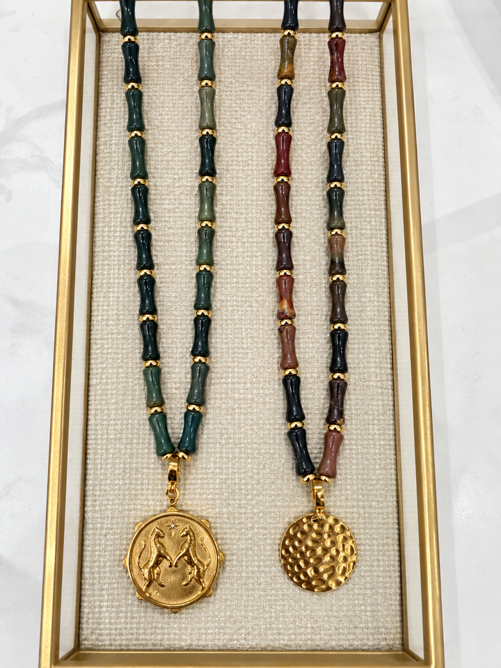 a couple of necklaces in a box