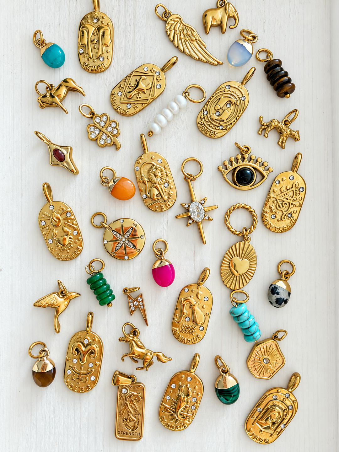 a collection of gold charms