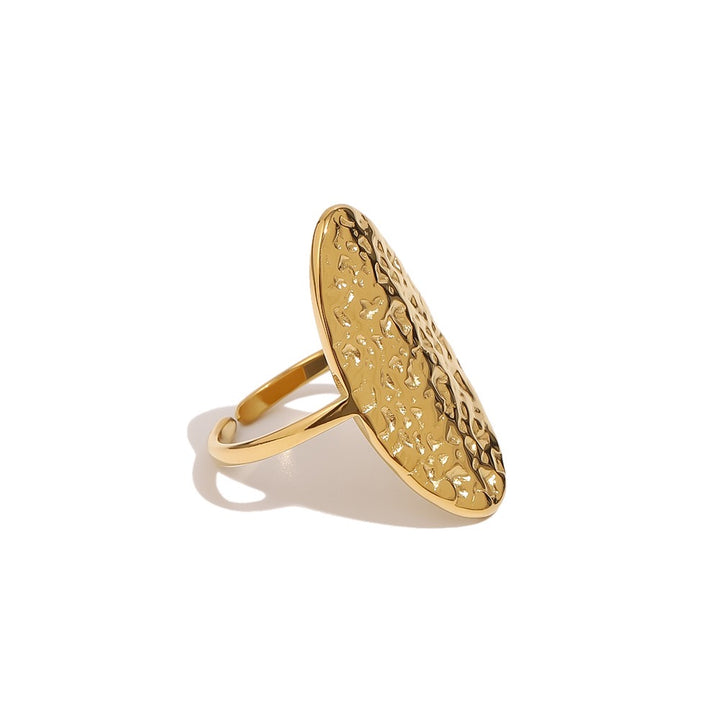 a gold ring with a textured surface