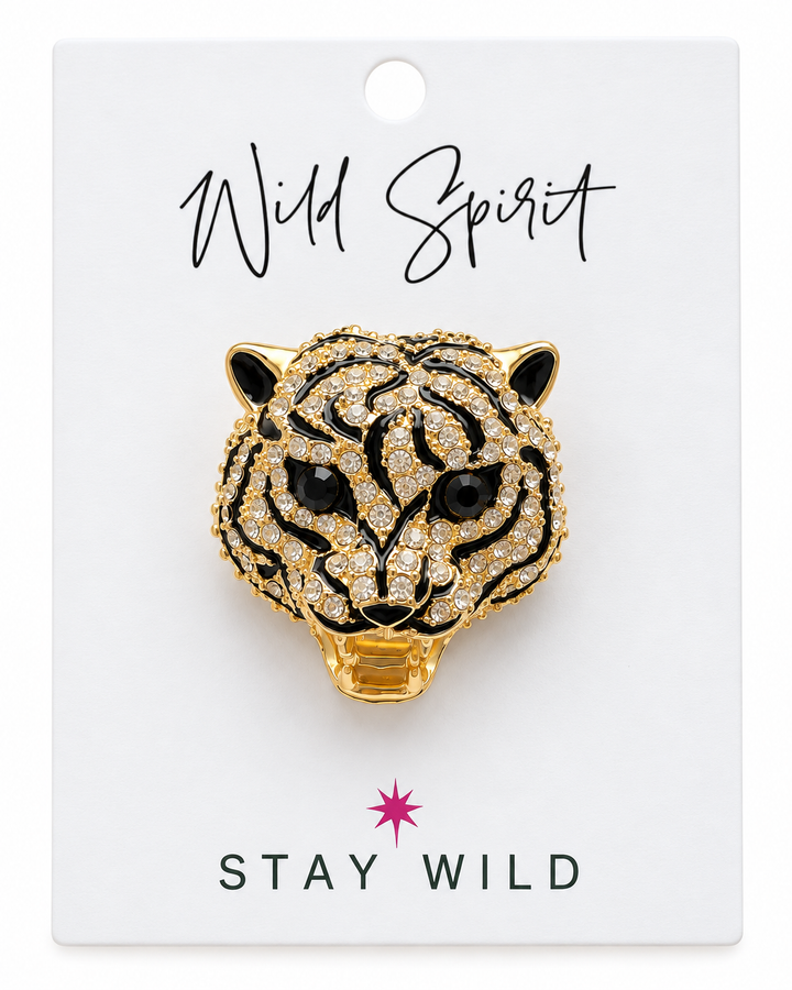 a gold tiger pin on a white background