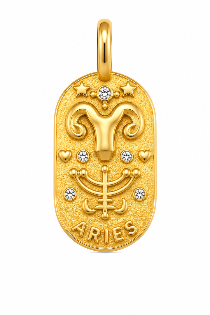 a gold pendant with a symbol of the zodiac