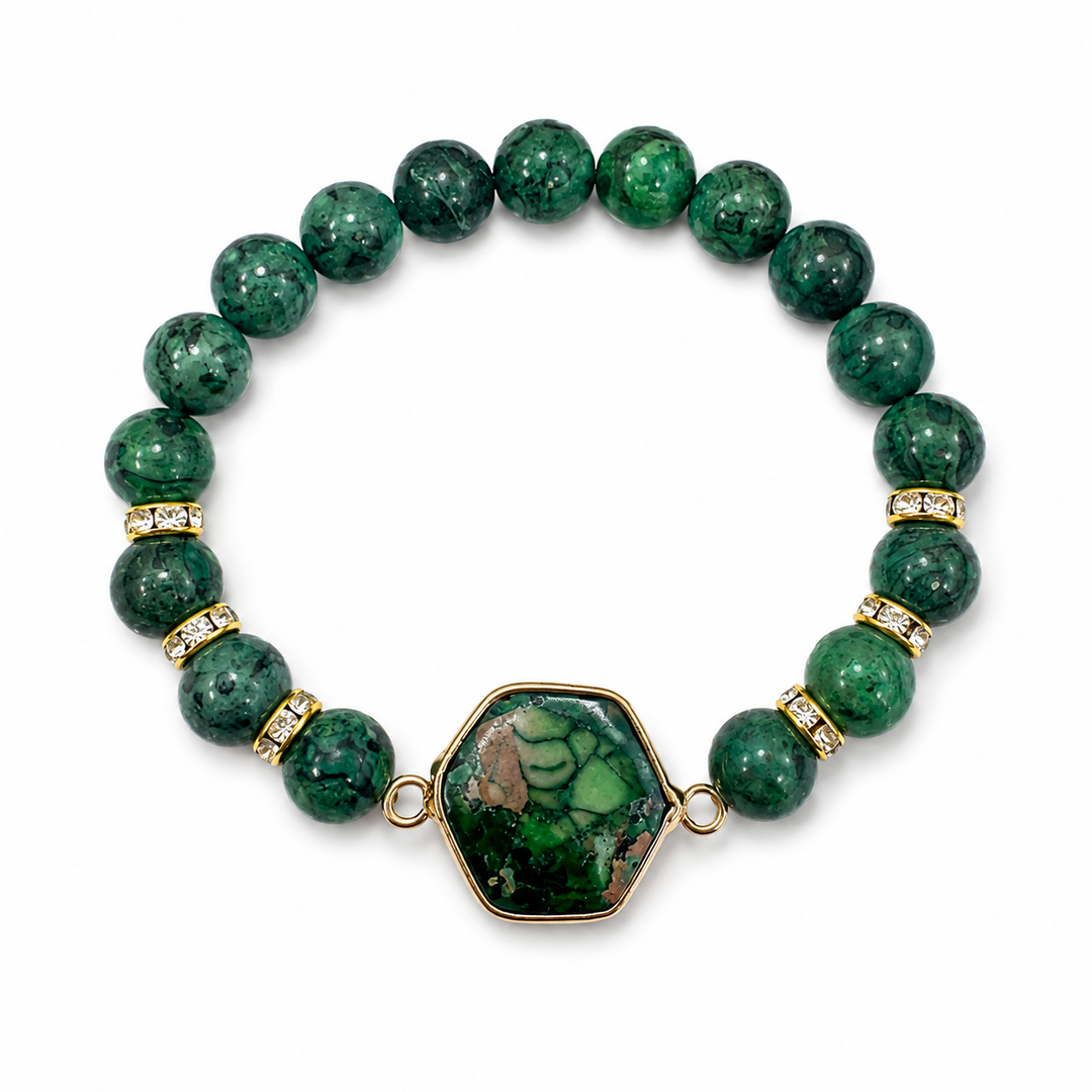 a green beaded bracelet with a gold and green stone pendant