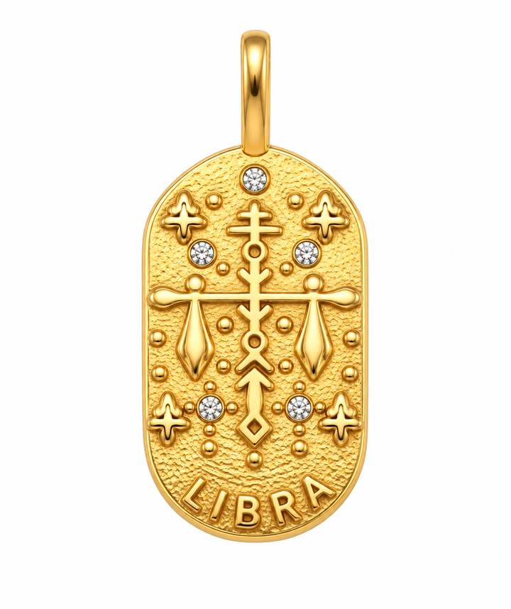 a gold pendant with diamonds and a cross