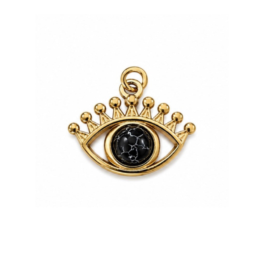 a gold eye with a black stone in the center