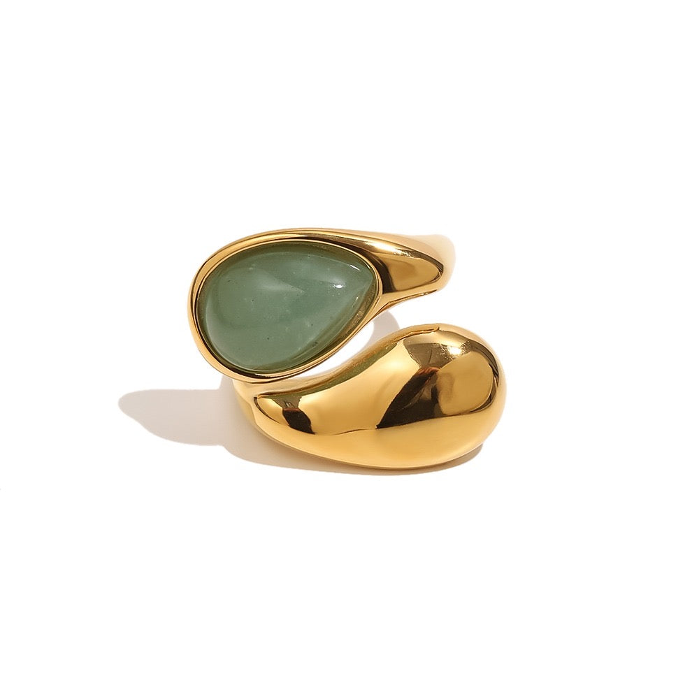 a gold and green ring
