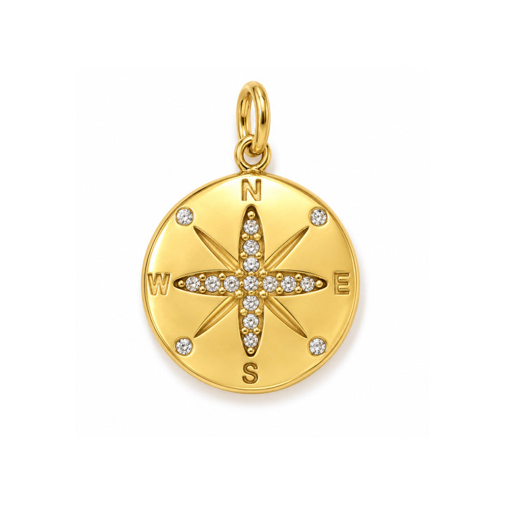 a gold medallion with diamonds and a compass