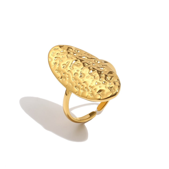a gold ring with a textured surface