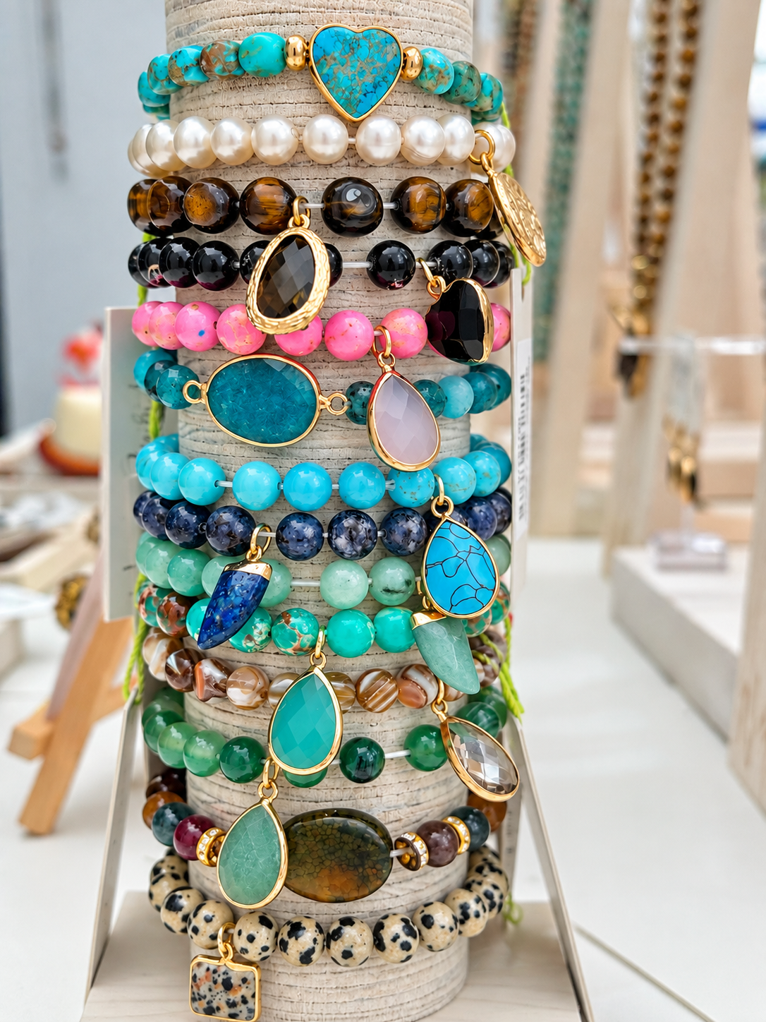 a stack of bracelets on a stand