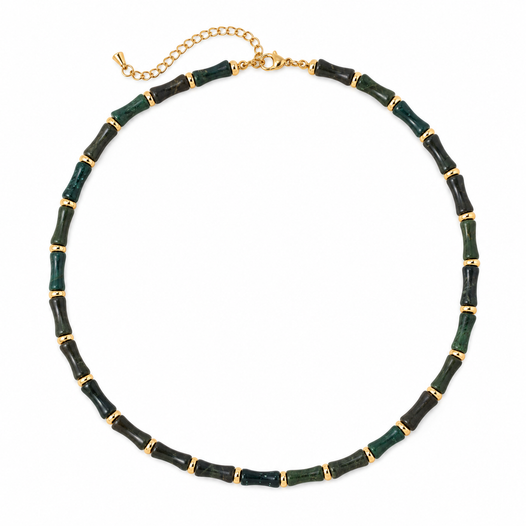 a necklace with green and gold beads