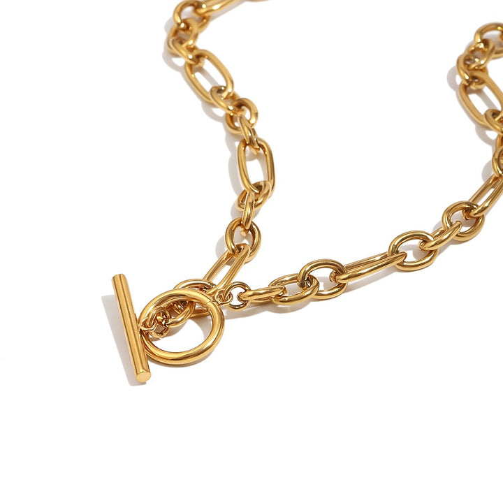 a gold chain with a toggle clasp