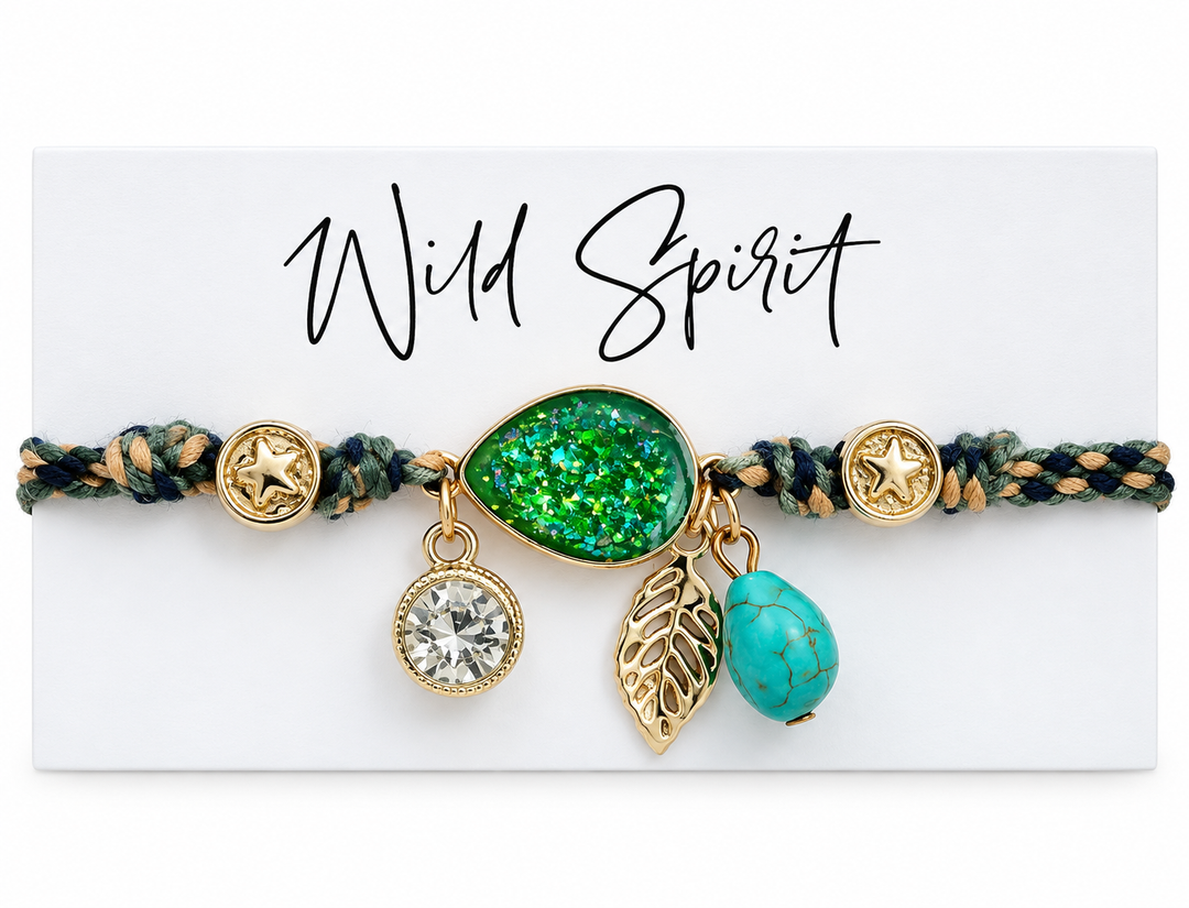 a bracelet with gold charms and a green leaf and a blue stone