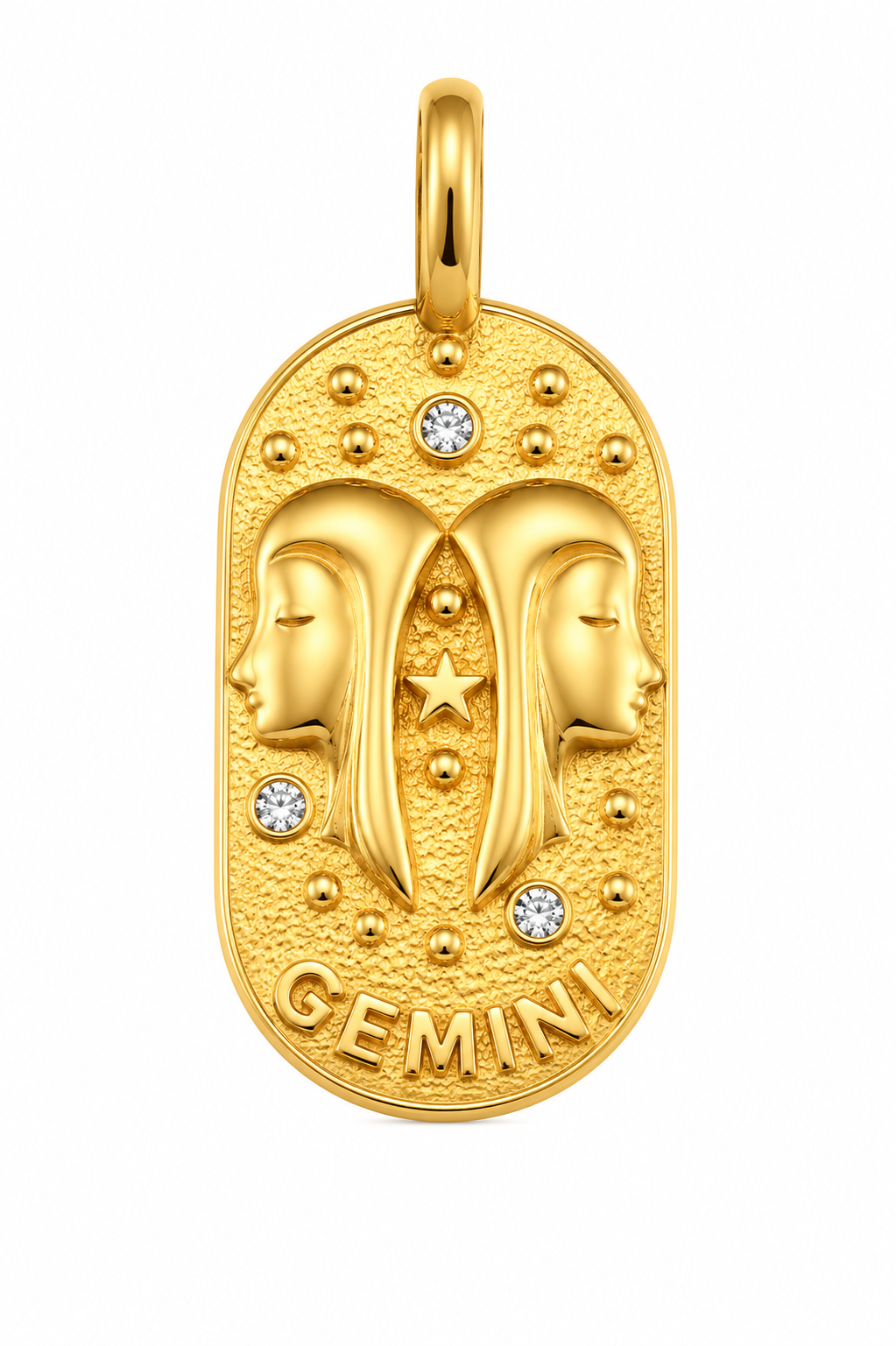 a gold pendant with two faces and diamonds
