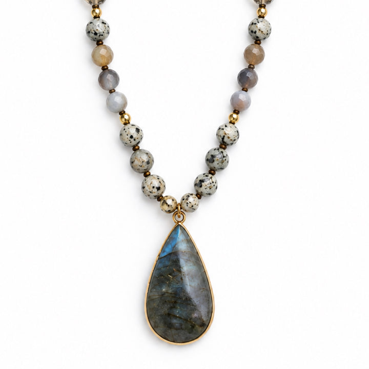 a necklace with a stone pendant