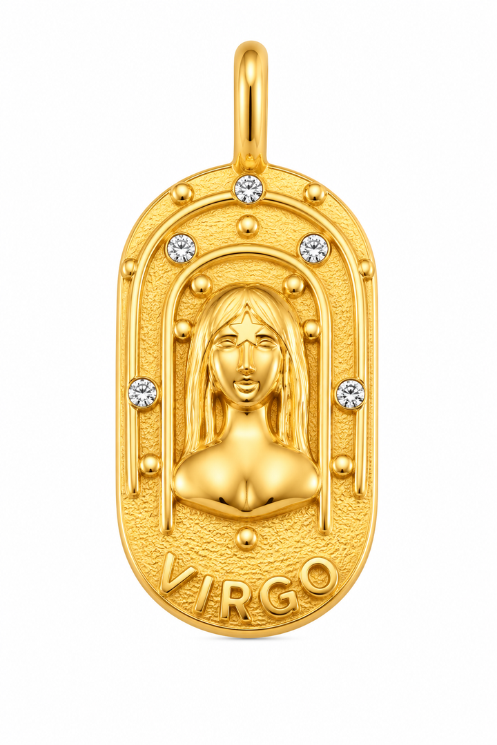 a gold pendant with a woman's face and diamonds