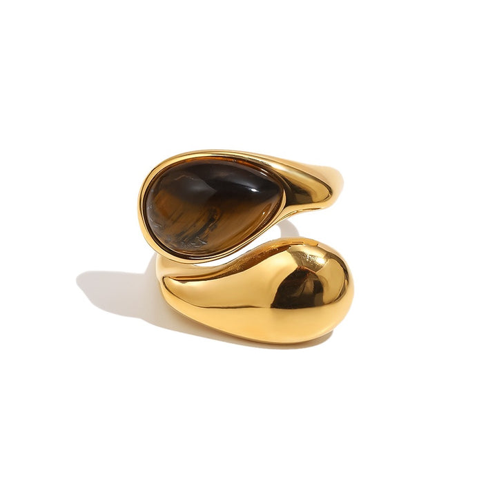 a gold ring with a black stone
