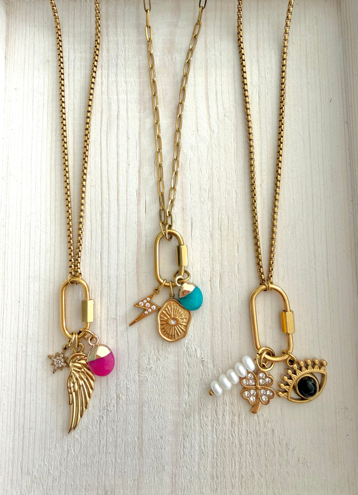 a group of gold necklaces