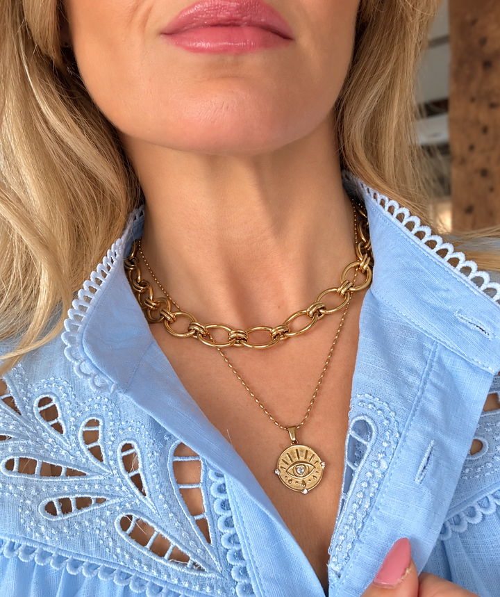 a woman wearing a necklace