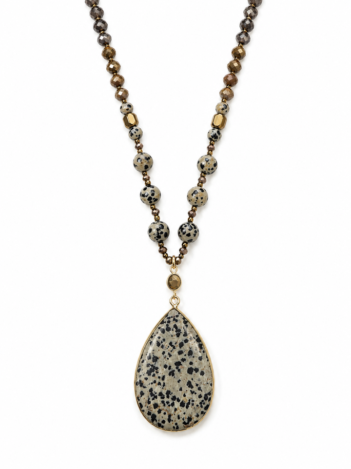 a necklace with a stone pendant