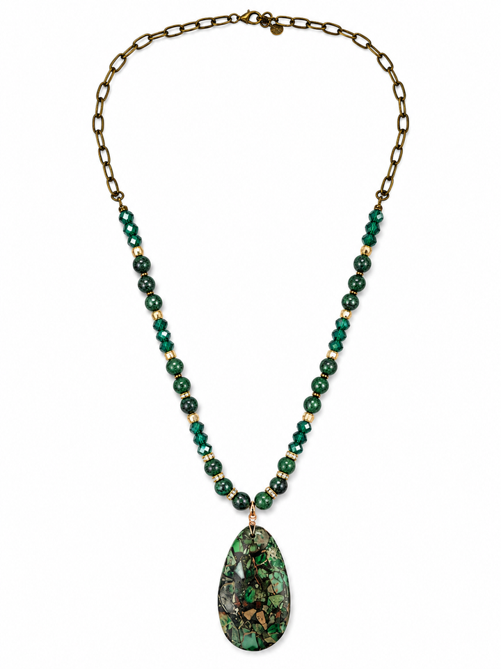a necklace with a green pendant
