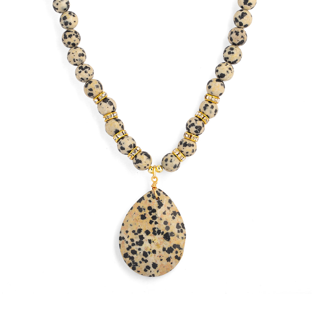 a necklace with a stone pendant
