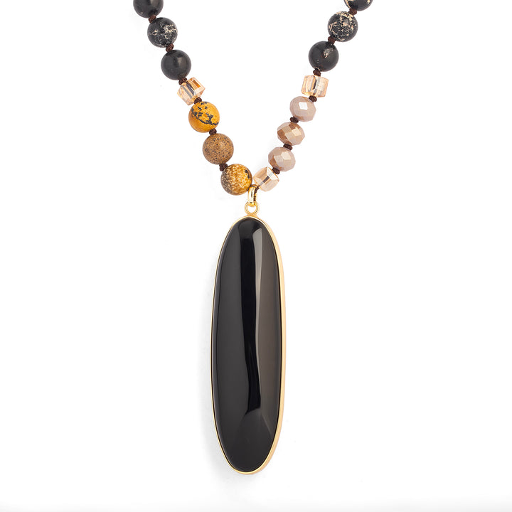a necklace with a black stone pendant