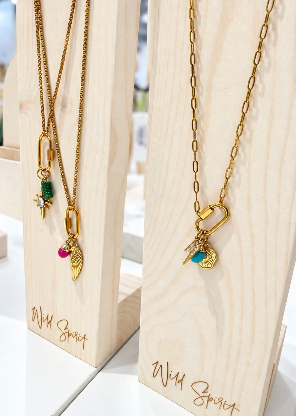 a group of necklaces on a stand