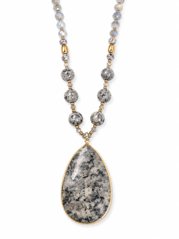 a necklace with a stone pendant