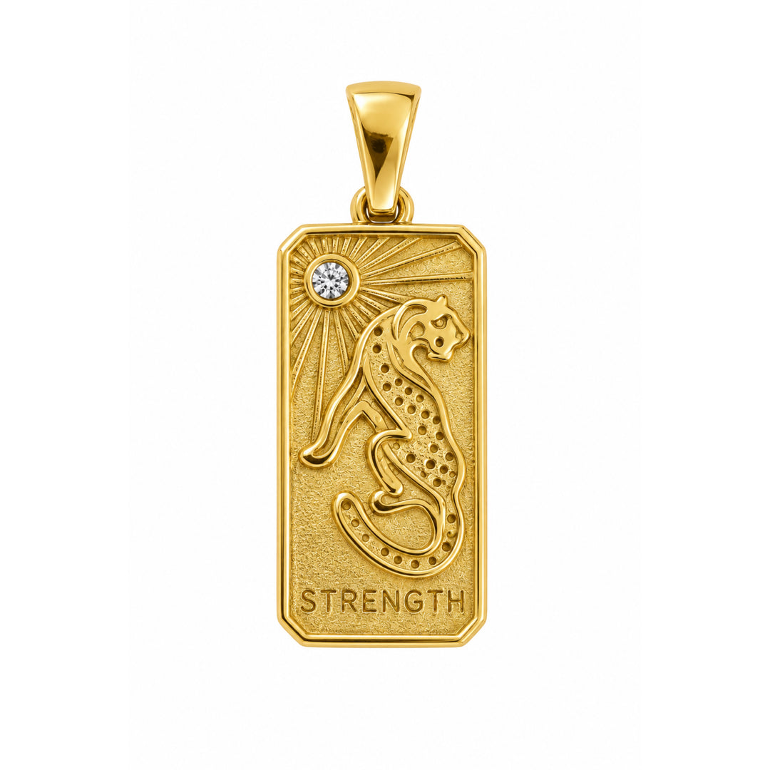 a gold pendant with a leopard and a diamond