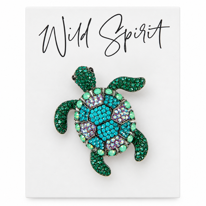 a brooch with a turtle design on it