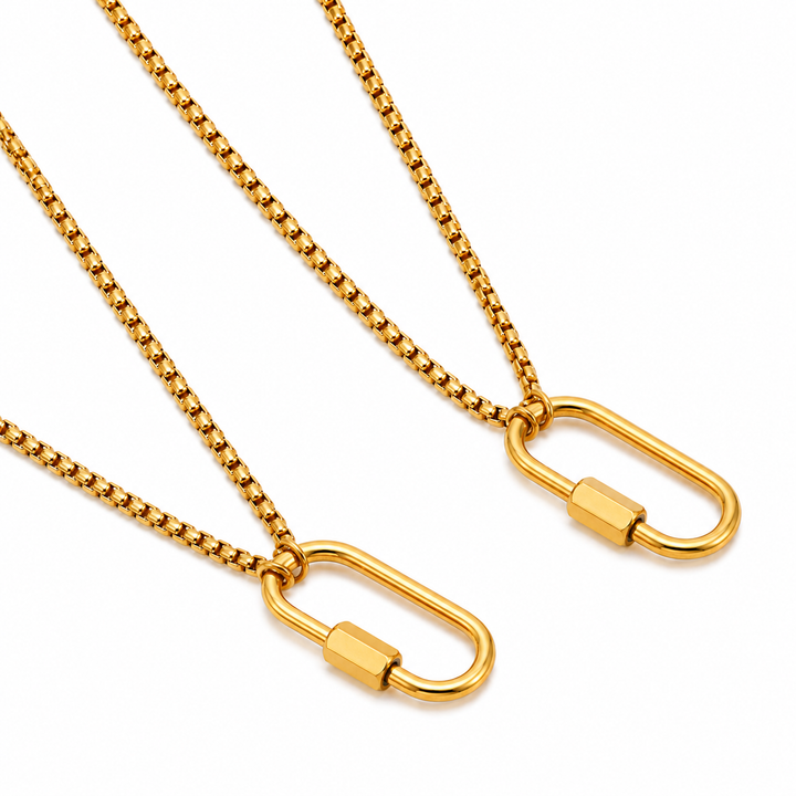 a pair of gold chains with a lock