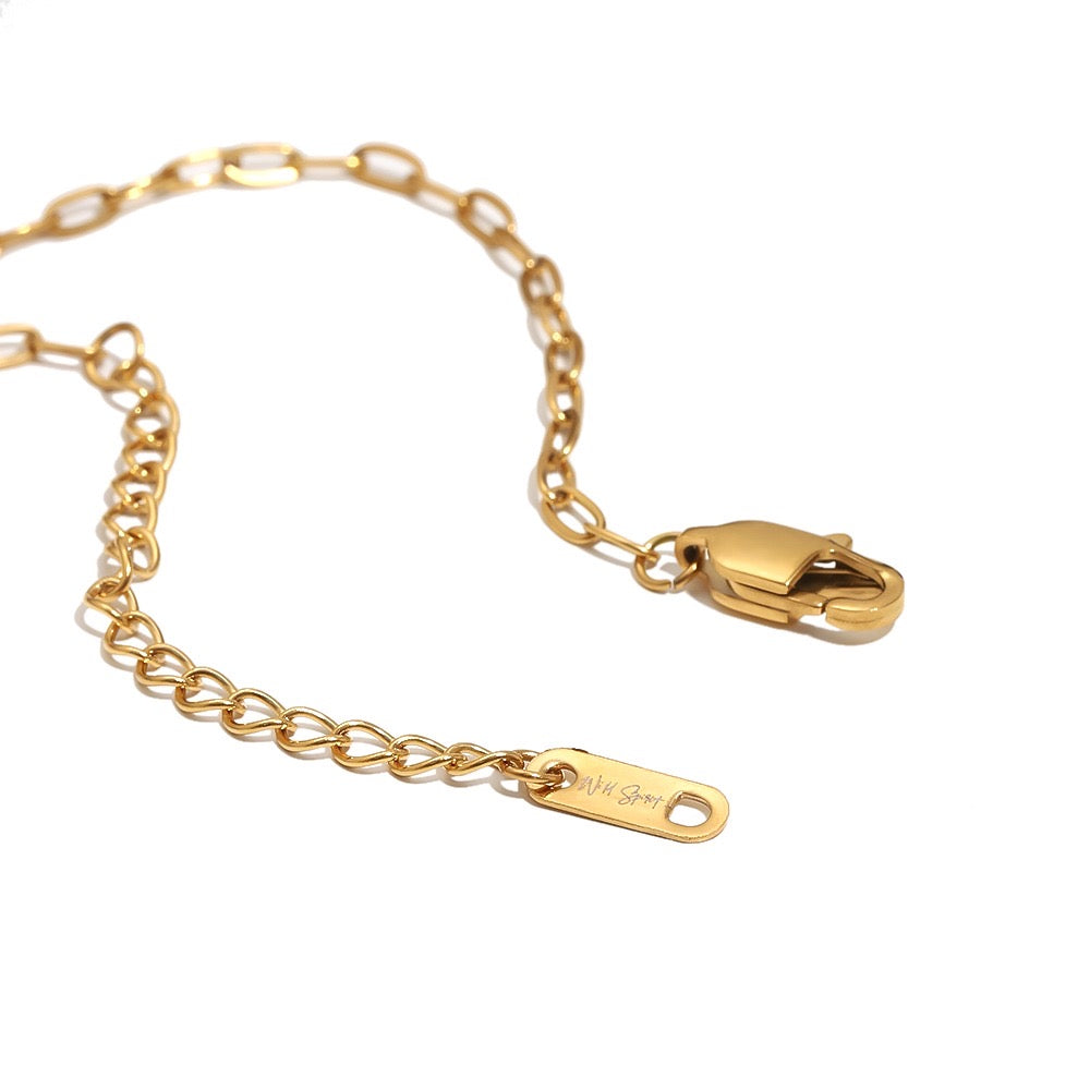 a gold chain with a clasp